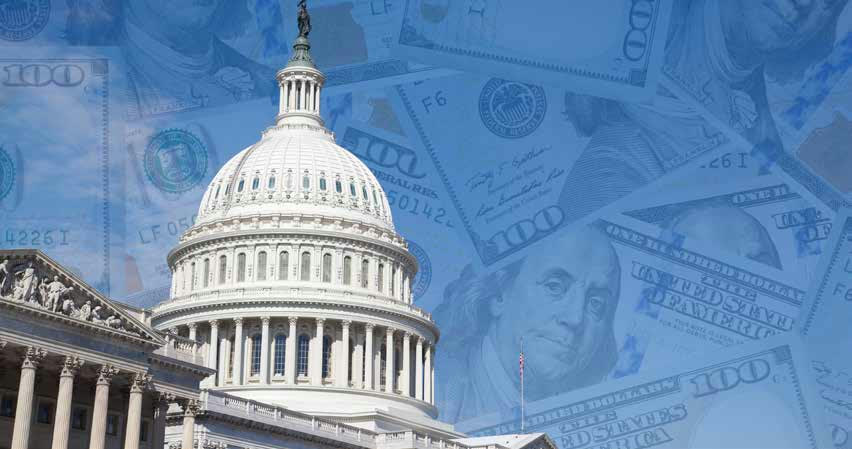 The U.S. Capitol over a field of hundred-dollar bills