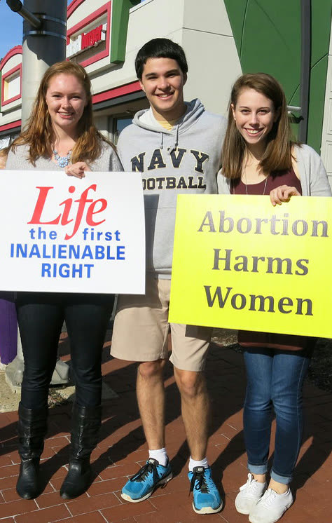Students holding pro-life signs